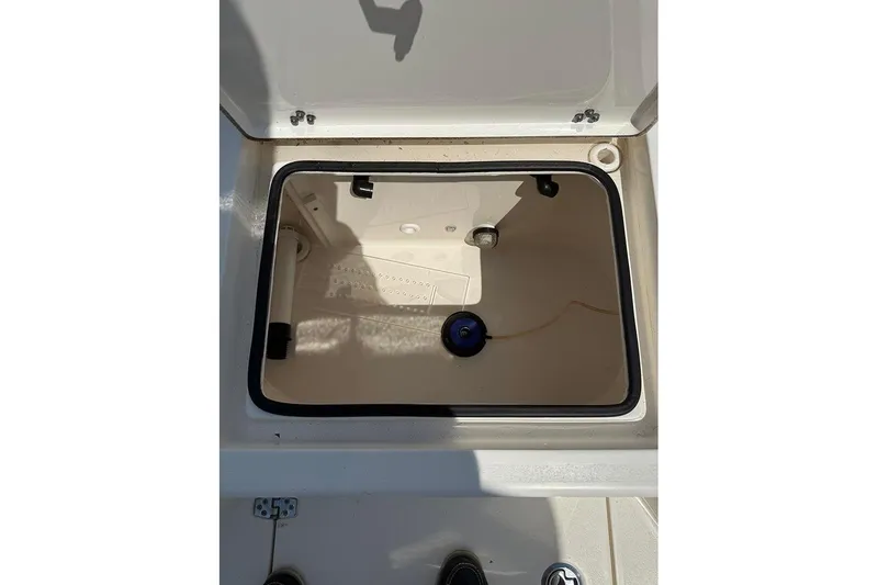 Slide: The Image of Open storage compartment on a 2020 Pathfinder 2500 Hybrid boat, showcasing interior space. - 10