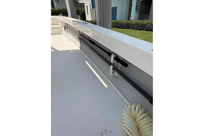 Slide: The Image of Interior view of a 2020 Pathfinder 2500 Hybrid boat, showcasing rod holders and deck. - 12