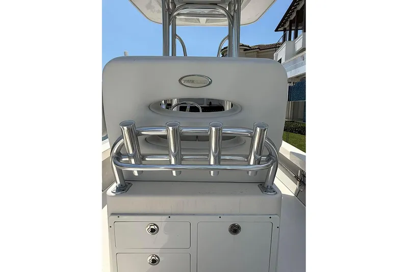Slide: The Image of 2020 Pathfinder 2500 Hybrid boat console with rod holders and storage compartments. - 14