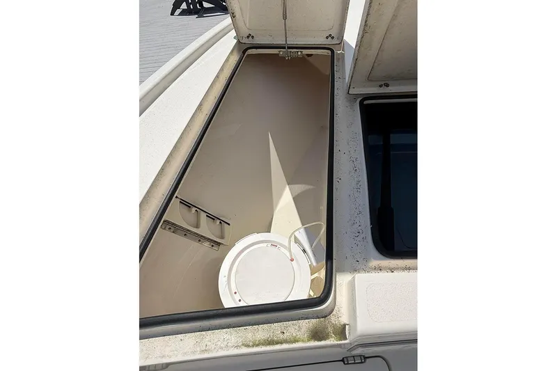 Slide: The Image of Open storage compartment on 2020 Pathfinder 2500 Hybrid boat. - 15
