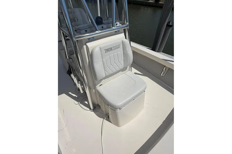Slide: The Image of 2020 Pathfinder 2500 Hybrid boat seat with storage, white upholstery, and stainless steel frame. - 17