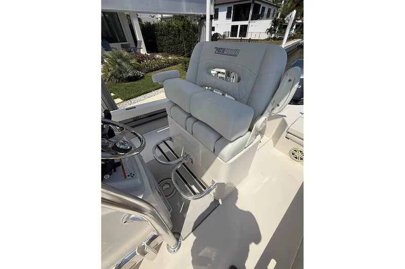 Slide: The Image of 2020 Pathfinder 2500 Hybrid boat seat with steering wheel and footrests. - 23