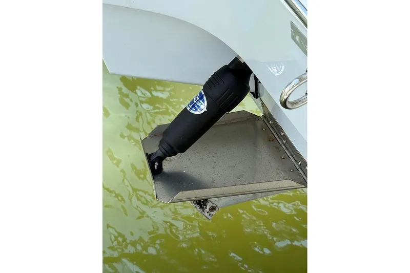 Slide: The Image of Pathfinder 2500 Hybrid 2020 boat trim tab in water. - 28