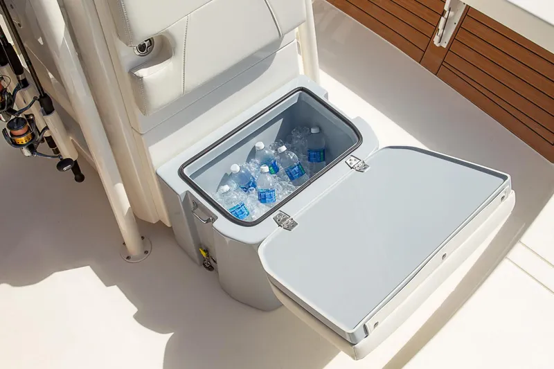 Slide: The Image of Manufacturer Provided Image: Built-in cooler with water bottles on 2020 Pathfinder 2500 Hybrid boat. - 36