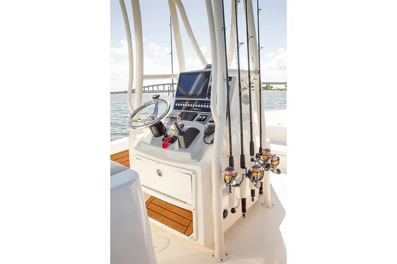 Slide: The Image of Manufacturer Provided Image: 2020 Pathfinder 2500 Hybrid boat console with fishing rods and navigation equipment. - 38