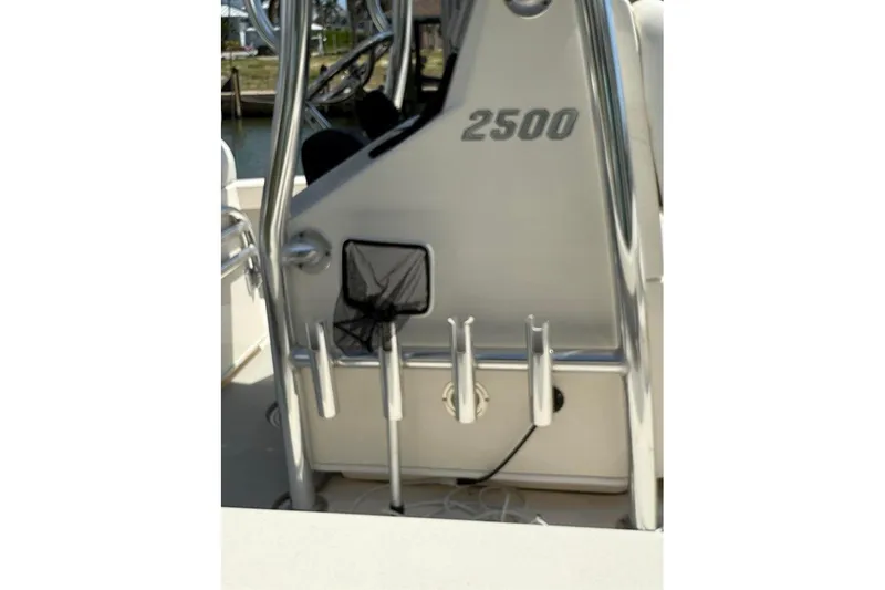 Slide: The Image of Pathfinder 2500 Hybrid boat console, 2020 model, with rod holders and net storage. - 4