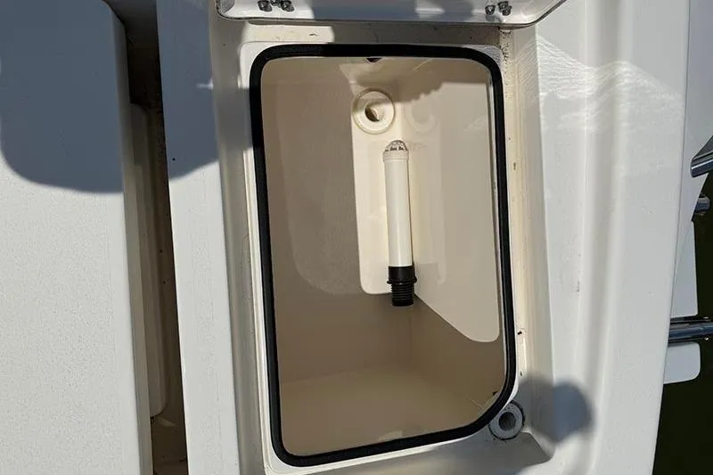 Slide: The Image of Open storage compartment on a 2020 Pathfinder 2500 Hybrid boat. - 7
