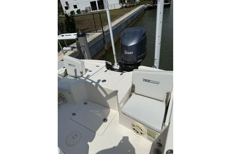 Slide: The Image of 2020 Pathfinder 2500 Hybrid boat with Yamaha 300 engine, docked near a canal. - 9