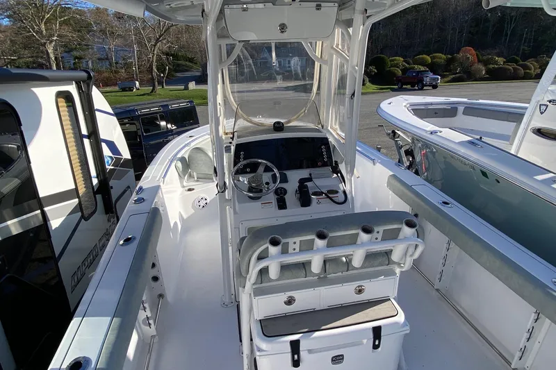 Slide: The Image of 2019 Sportsman Open 232 Center Console boat interior with steering wheel and seating. - 11
