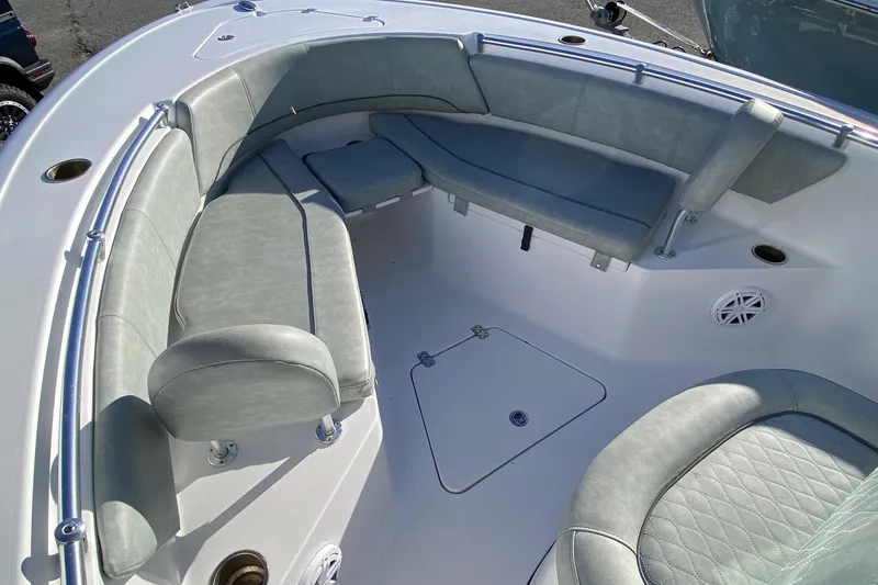 Slide: The Image of 2019 Sportsman Open 232 Center Console boat interior with cushioned seating. - 13