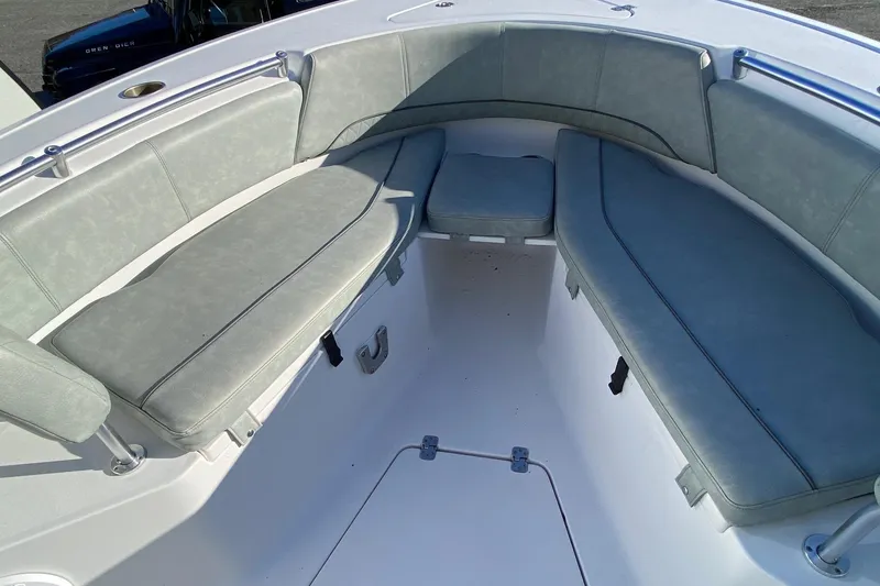 Slide: The Image of 2019 Sportsman Open 232 Center Console boat interior with cushioned seating. - 14