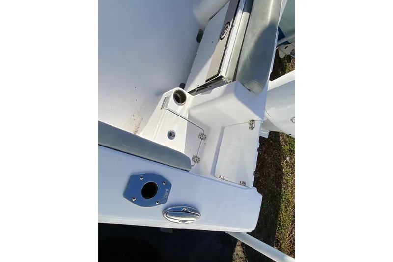 Slide: The Image of 2019 Sportsman Open 232 Center Console boat interior with storage compartments. - 15