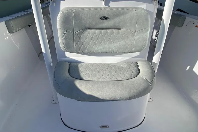 Slide: The Image of 2019 Sportsman Open 232 Center Console boat seat with gray cushioned upholstery. - 17