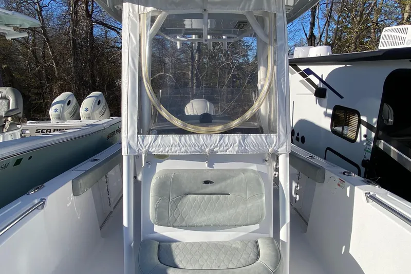 Slide: The Image of 2019 Sportsman Open 232 Center Console boat with seating and protective cover. - 20