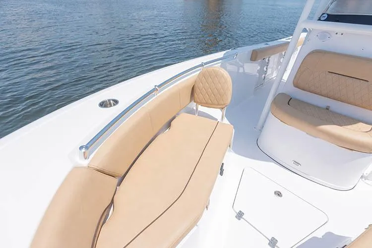 Slide: The Image of Manufacturer Provided Image: 2019 Sportsman Open 232 Center Console boat with tan seating and white deck. - 22
