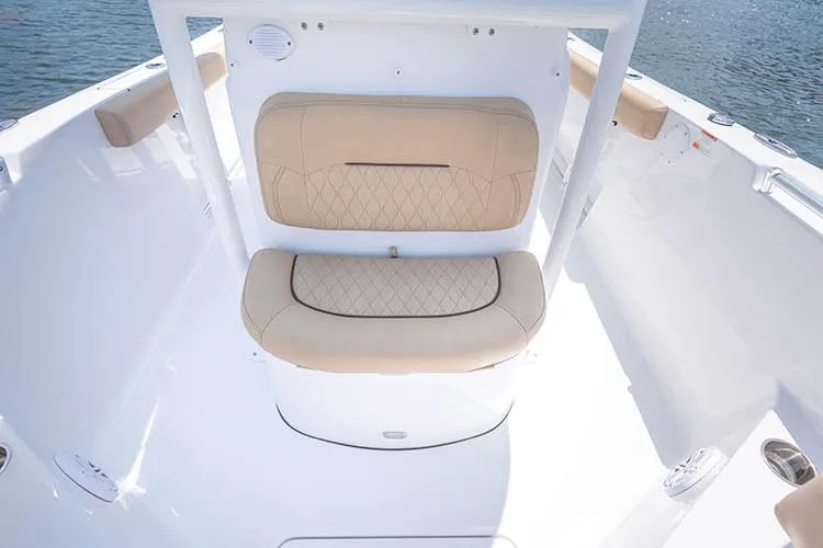 Slide: The Image of Manufacturer Provided Image: 2019 Sportsman Open 232 Center Console boat interior with beige cushioned seating. - 23