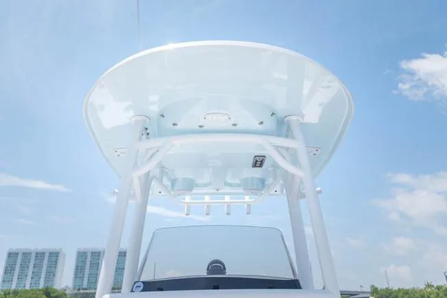 Slide: The Image of Manufacturer Provided Image: 2019 Sportsman Open 232 Center Console boat with T-top against blue sky. - 25