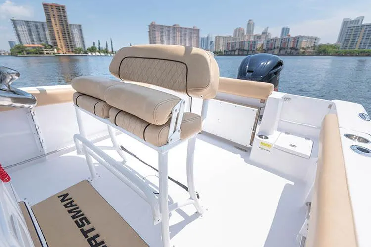 Slide: The Image of Manufacturer Provided Image: 2019 Sportsman Open 232 Center Console boat interior with seating and waterfront view. - 28