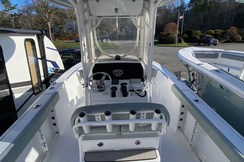 Slide: The Image of 2019 Sportsman Open 232 Center Console boat interior with steering wheel and seating. - 5