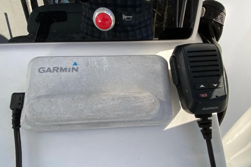 Slide: The Image of Garmin marine equipment on a 2019 Sportsman Open 232 Center Console boat. - 8
