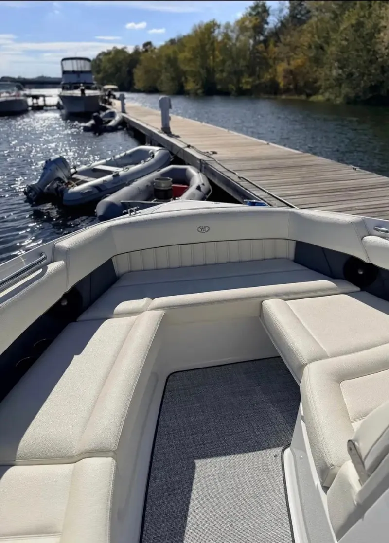 Slide: The Image of Cobalt R35 2020 boat docked by a sunny pier. - 14