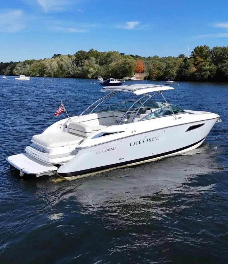 Slide: The Image of Cobalt R35 boat 2020 on calm water with trees in background. - 2