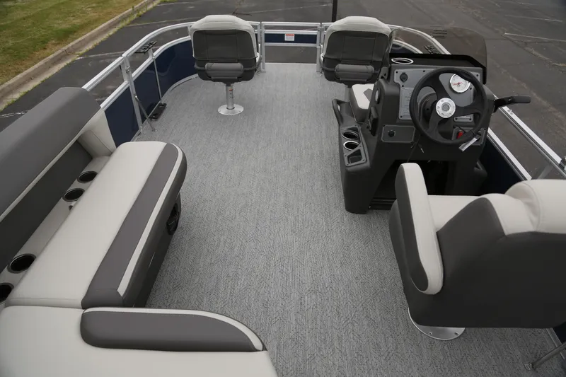 Slide: The Image of 2026 Sun Tracker Bass Buggy 16 XL Select pontoon boat interior with seating and steering console. - 4