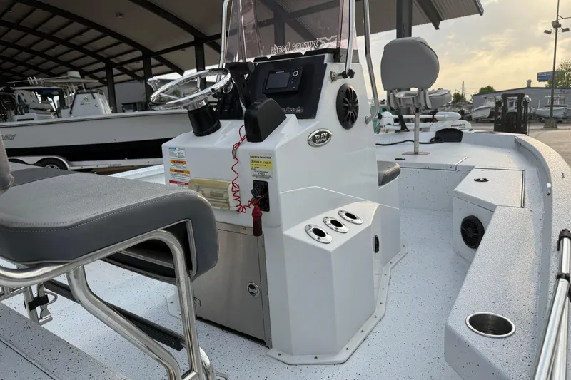 Slide: The Image of 2022 Xpress H20B Bay boat interior with steering console and seating. - 11