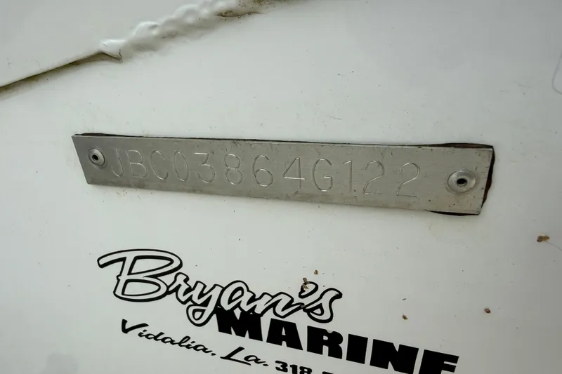 Slide: The Image of 2022 Xpress H20B Bay boat with identification plate and Bryan's Marine logo. - 13