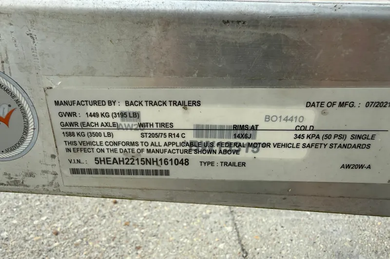Slide: The Image of Label on a 2022 Xpress H20B Bay trailer, detailing manufacturing and safety specifications. - 15