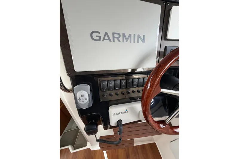 Slide: The Image of Helm of 2026 Cutwater C-288 CB with Garmin navigation system and wooden steering wheel. - 10