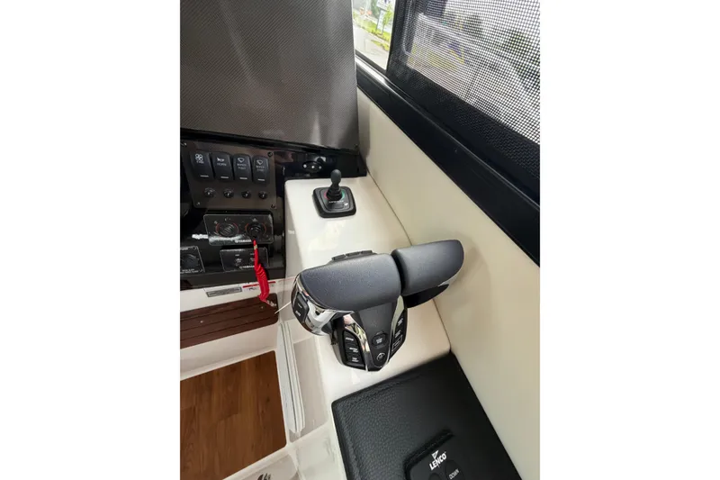 Slide: The Image of Control panel of 2026 Cutwater C-288 CB boat, featuring joystick and throttle controls. - 11