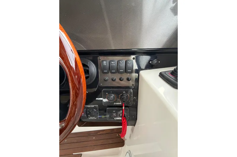 Slide: The Image of 2026 Cutwater C-288 CB dashboard with control switches and steering wheel detail. - 12