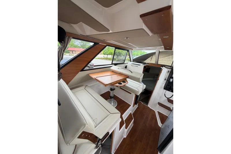 Slide: The Image of Interior of 2026 Cutwater C-288 CB boat with modern seating and wooden accents. - 8