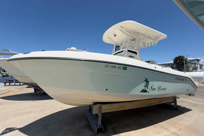 The Image of 2016 Century 2301 Center Console boat named "Sea Breeze" on display under clear blue sky. - 0