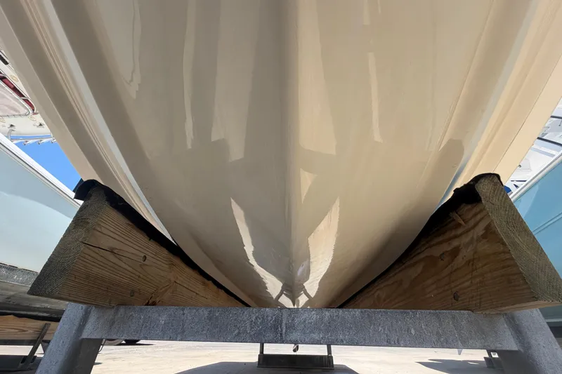 Slide: The Image of 2016 Century 2301 Center Console boat hull on wooden support. - 18