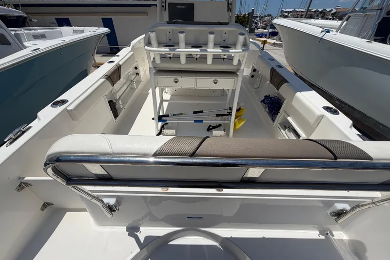 Slide: The Image of 2016 Century 2301 Center Console boat interior with seating and storage compartments. - 20