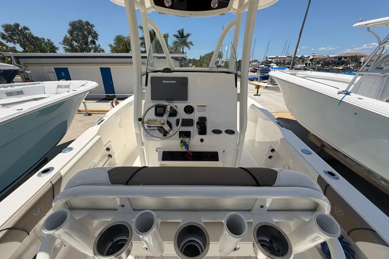 Slide: The Image of 2016 Century 2301 Center Console boat interior with steering wheel and control panel. - 26