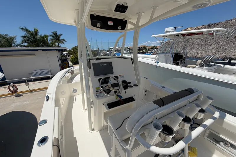 Slide: The Image of 2016 Century 2301 Center Console boat with steering wheel and navigation system. - 27