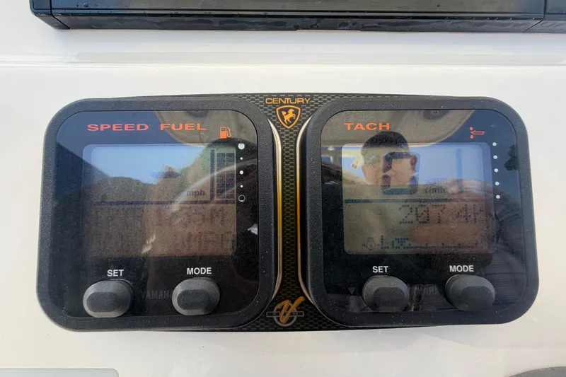 Slide: The Image of Digital gauges on a 2016 Century 2301 Center Console boat dashboard. - 31