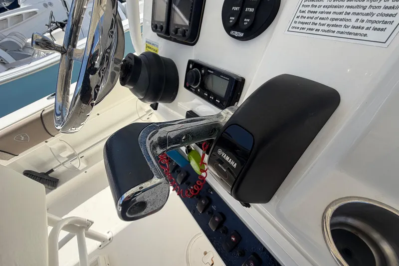 Slide: The Image of Century 2301 Center Console 2016 boat helm with Yamaha controls and steering wheel. - 36
