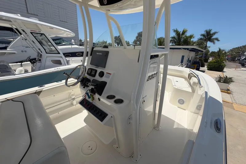 Slide: The Image of 2016 Century 2301 Center Console boat interior with steering wheel and control panel. - 41