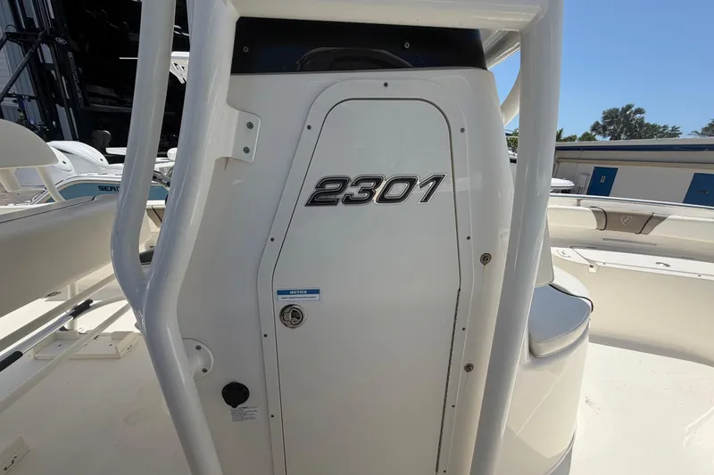 Slide: The Image of 2016 Century 2301 Center Console boat, white exterior, close-up view of console area. - 42