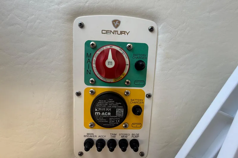 Slide: The Image of Control panel of a 2016 Century 2301 Center Console boat with battery charger switches. - 45