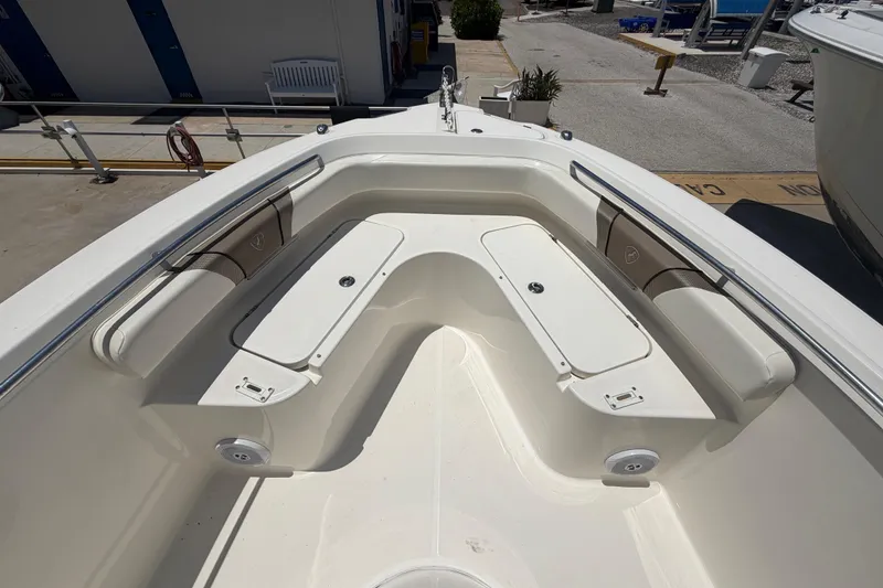 Slide: The Image of 2016 Century 2301 Center Console boat interior with seating and storage compartments. - 47