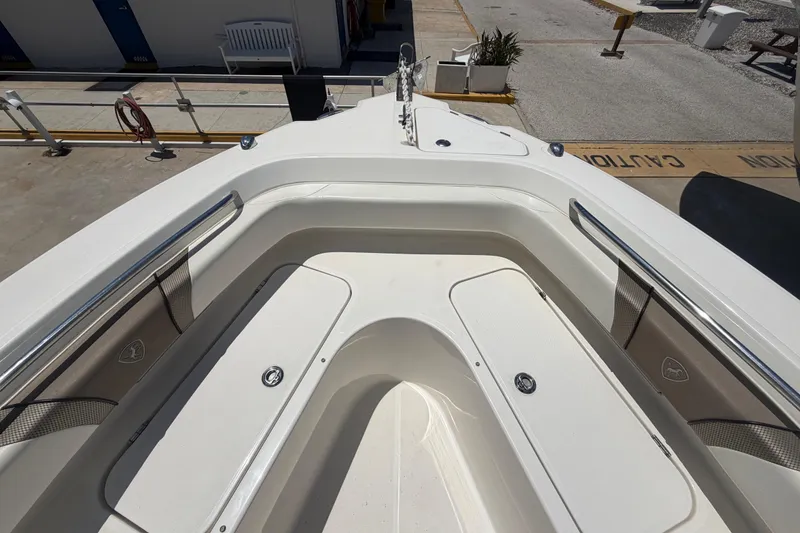 Slide: The Image of 2016 Century 2301 Center Console boat interior with seating and storage compartments. - 48