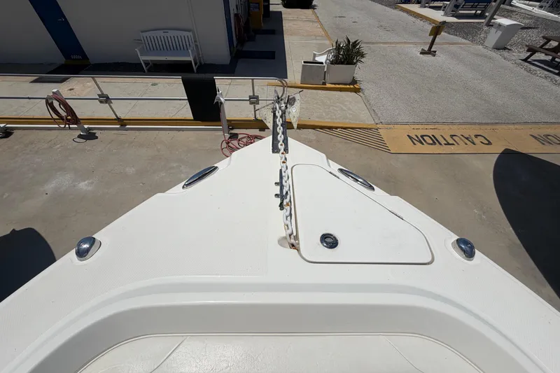 Slide: The Image of Bow view of a 2016 Century 2301 Center Console boat on a dock. - 49