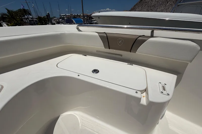 Slide: The Image of 2016 Century 2301 Center Console boat interior with storage compartment and seating. - 53