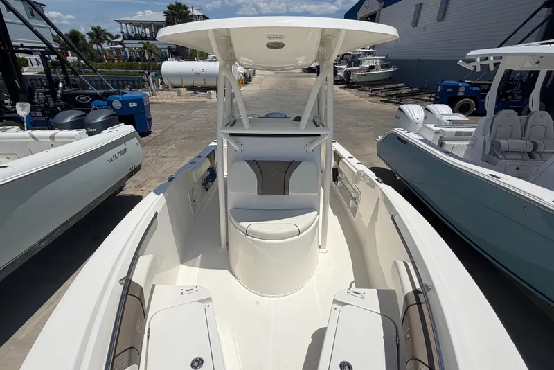Slide: The Image of 2016 Century 2301 Center Console boat docked, showcasing spacious seating and modern design. - 58