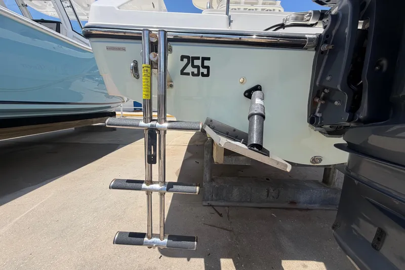 Slide: The Image of 2016 Century 2301 Center Console boat with ladder and motor detail. - 6